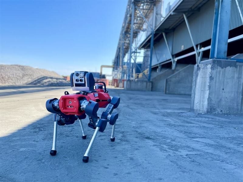 Quadruped robot patrolling an outdoor plant area
